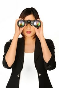 female looking through binoculars lg